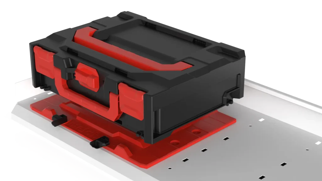 Black and red modular drive carrier mounted in a server rack, featuring red latches and a red base plate on a perforated metal tray for a drive bay.