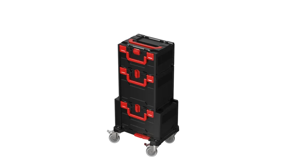 Black rolling tool chest with red handles and latches on caster wheels