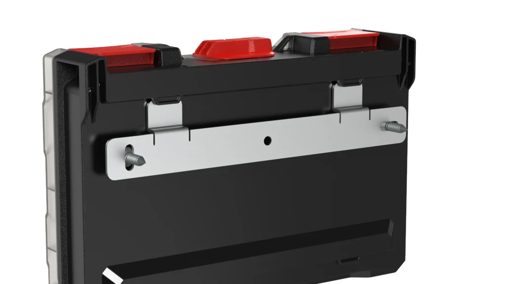Close-up of black control module with three red toggle levers on top and a silver mounting plate.