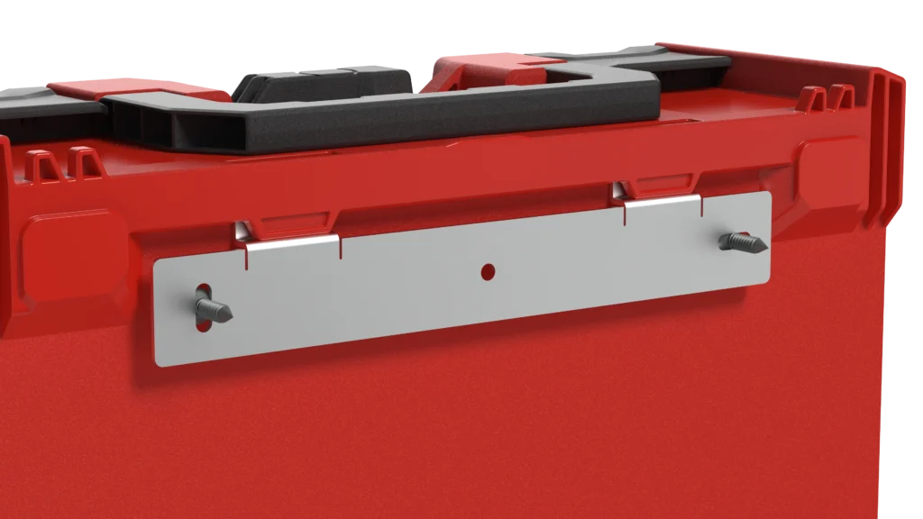Close-up of a red industrial device housing with a silver mounting plate secured by bolts on the side.