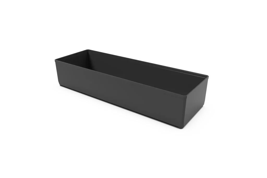 Long rectangular gray planter box resting on a white surface, viewed from a low angle.